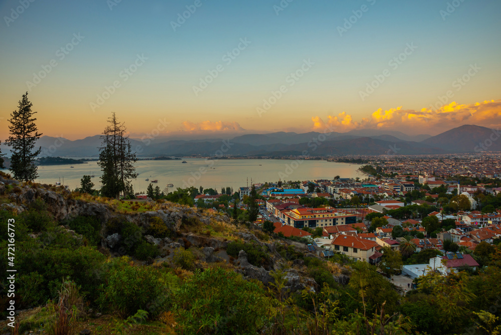 FETHIYE, TURKEY: Top view of the Turkish city of Fethiye in the evening. FETHIYE, TURKEY: Top view of the Turkish city of Fethiye in the evening.