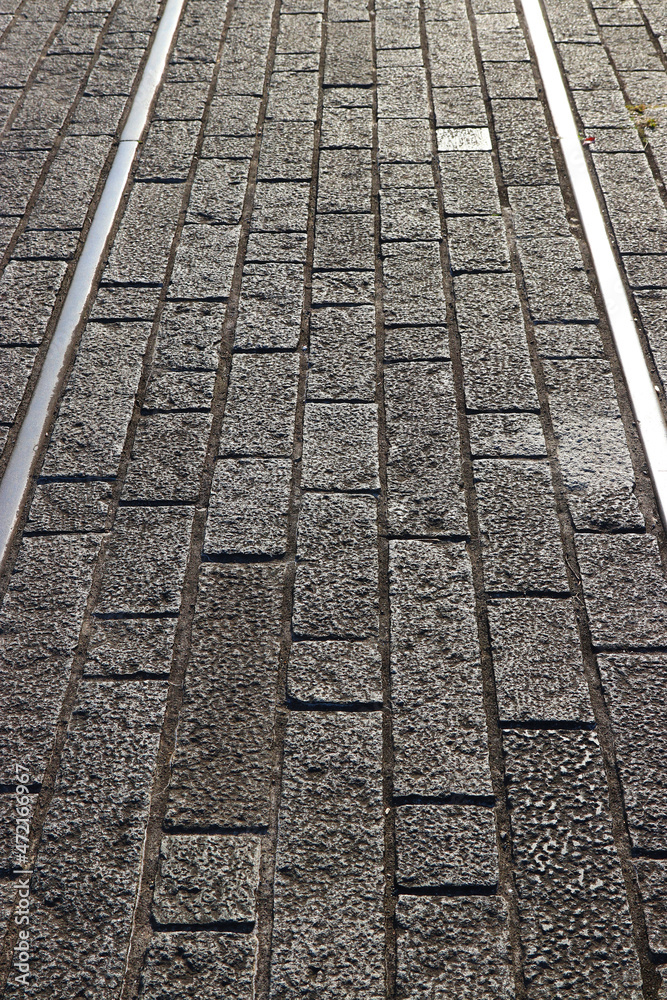 Historical remains of the first railroad in Japan. 横浜赤レンガ倉庫横に残されている日本初の明治時代、鉄道のレールと石畳の遺跡。 Historical remains of the first railroad in Japan. 横浜赤レンガ倉庫横に残されている日本初の明治時代、鉄道のレールと石畳の遺跡。