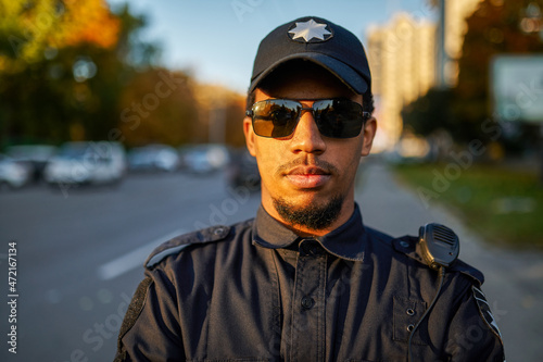 Police officer in uniform and sunglasses outdoors
