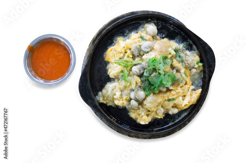Top view of Raw Oysters fried in egg batter hot pan with chilli sauce.