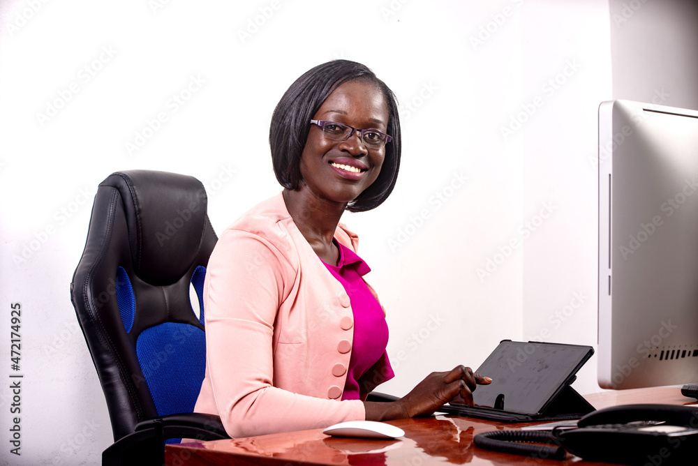 beautiful young businesswoman working with a digital tablet in the office. beautiful young businesswoman working with a digital tablet in the office.