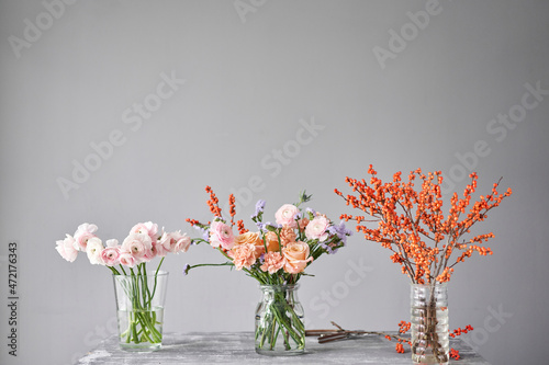 Finished flower arrangement in a vase for home. Flowers bunch, set for interior. Fresh cut flowers for decoration home. European floral shop. Delivery fresh cut flower.