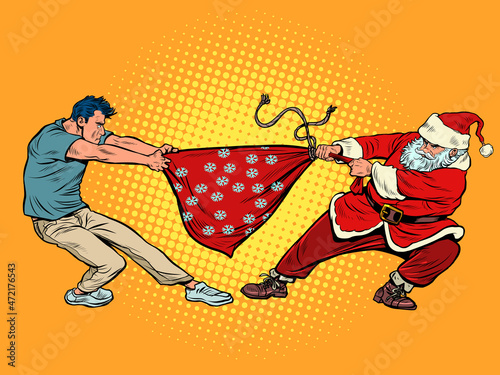 A man takes a bag of gifts from Santa Claus. Christmas and New Year winter holidays