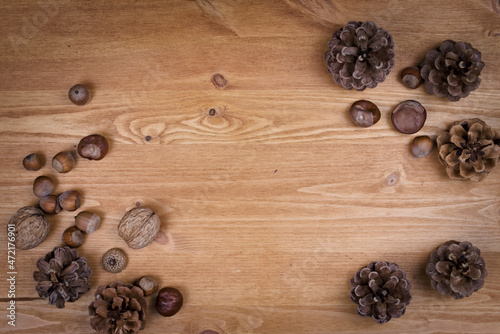 wooden background with pine cones, autumn