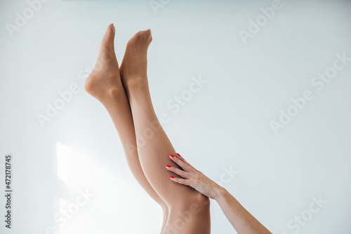 beautiful slender women s legs in light tights