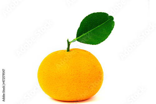 Tangerine and leaves isolated on white background.