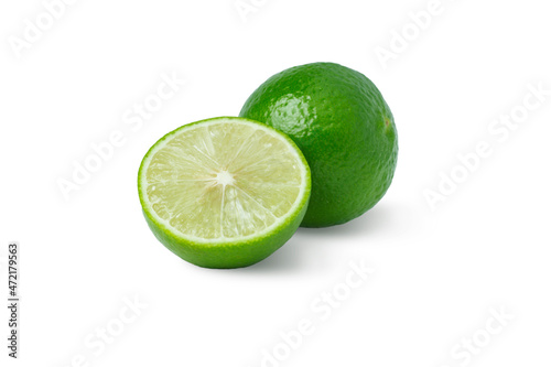 Lime with half and leaves isolated on white Background.