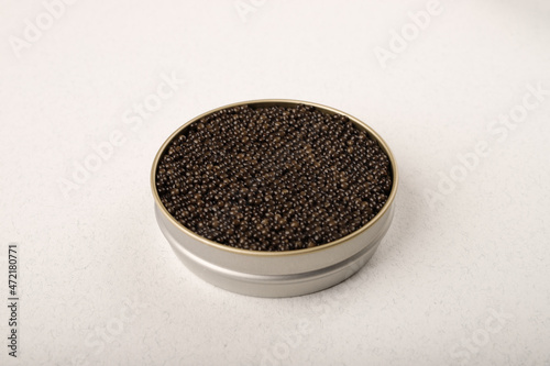 Black caviar in a metal jar