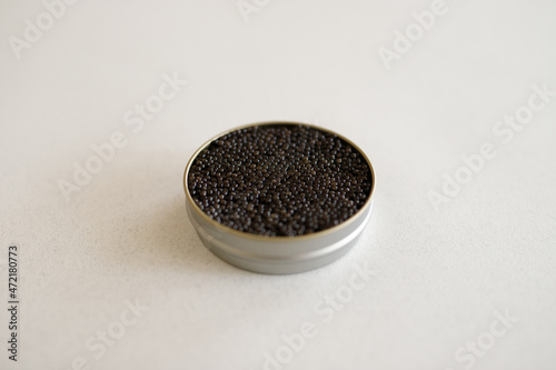 Black caviar in a metal jar