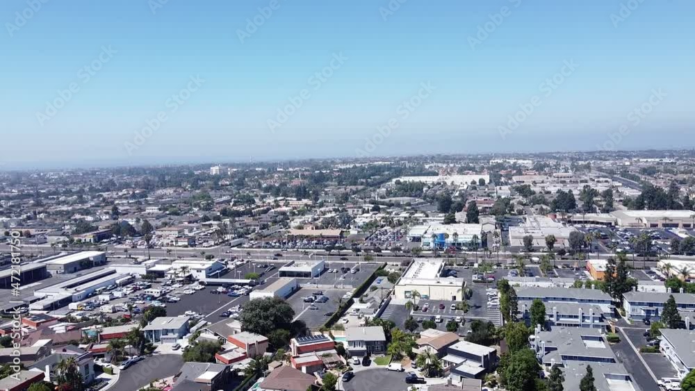 Aerial shot of a residential area on a warm, sunny day with a blue sky, concept for housing market and real estate investment. Huntington Beach, California, USA. Aerial shot of a residential area on a warm, sunny day with a blue sky, concept for housing market and real estate investment. Huntington Beach, California, USA.