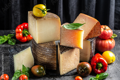 Assortment of cheeses, different kinds of delicious cheese, spanish manchego cheese photo