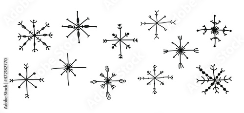 A set of snowflakes hand-drawn in boho style. Vector illustration for the decor of New Year's compositions, Christmas greetings in boho style. © Darya