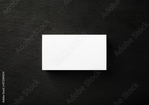 Photo of blank business card on stone board. Template for branding ID. Flat lay. © Veresovich