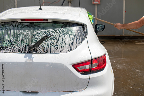 person cleaning car