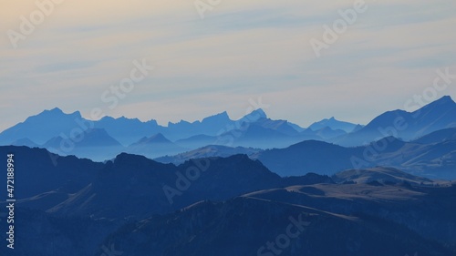 Blue silhouettes of mountains in the Bernese Oberland.