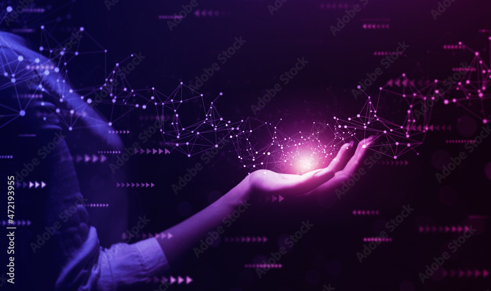 © Miha Creative - Metaverse Technology concepts. Woman hand holding global network connection. Internet communication, Wireless connection technology. Futuristic technology with polygonal shapes.