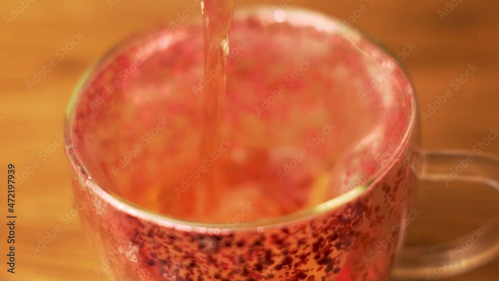 Tea Party, Black Fragrant Tea Is Poured into Cup, Macro, Close-up, Slow Motion. Tea Party, Black Fragrant Tea Is Poured into Cup, Macro, Close-up, Slow Motion.