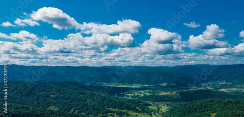 mountains aerial view in blue sky clouds