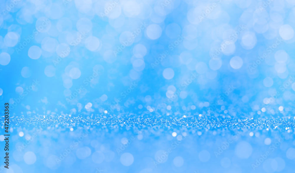 blue abstract festive background with defocused lights