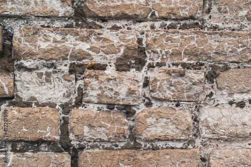 Futuristic brick wall. White stripes and cracks in brick.