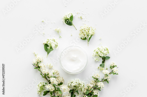 White spa medical herbal cosmetic with blossoms flowers