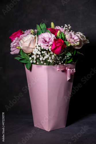 Fototapeta Naklejka Na Ścianę i Meble -  Beautiful bouquet of colorful rose flowers. Festive flowers concept.  Bouquet of fresh roses, freesias, eustoma and others.