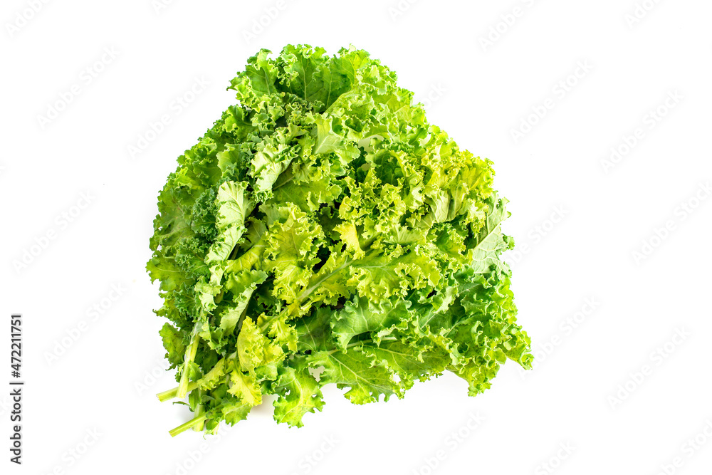 Fresh green kale leaves isolated on white background. Concept healthy food. Fresh green kale leaves isolated on white background. Concept healthy food.