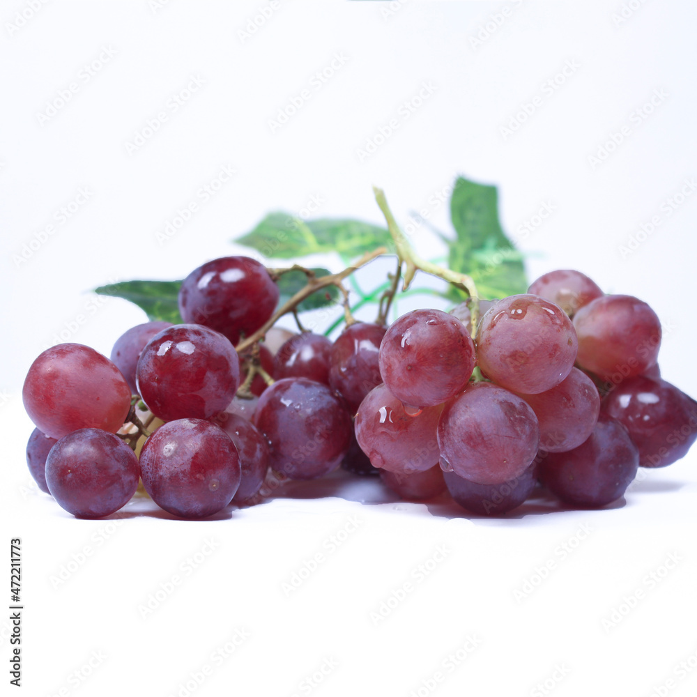 Grapes are the fruit of a woody grape vine. Grapes can be eaten raw, or used for making wine, juice, and jellyjam. Grapes come in different colours; red, purple, white. Fokus blur.