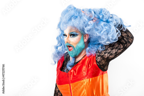 Drag queen with mouth open and hand in wig against white background photo