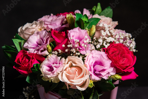 Beautiful floral bouquet on a black background. Fresh flowers in a bouquet. Close-up