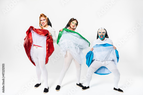 Drag queens pulling up skirts on white background