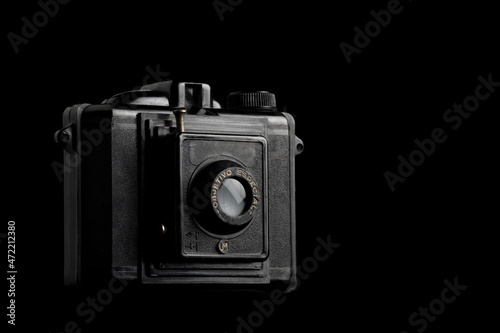 Old camera on black background