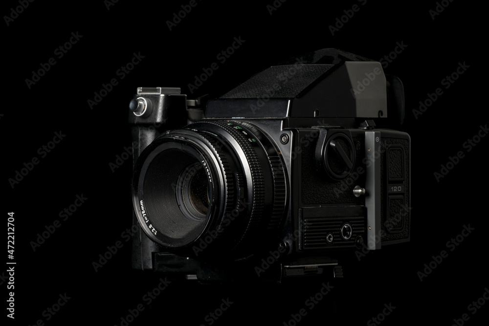 Old camera on black background Old camera on black background
