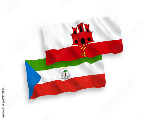 National vector fabric wave flags of Republic of Equatorial Guinea and Gibraltar isolated on white background. 1 to 2 proportion.