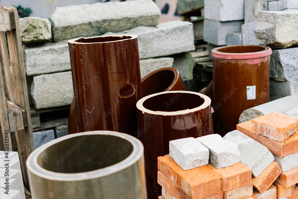 Large sectional sewer pipes, bricks, paves in warehouse construction Large sectional sewer pipes, bricks, paves in warehouse construction