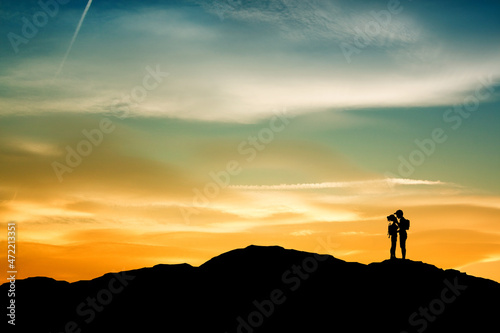 girl and boy go trekking in the mountains