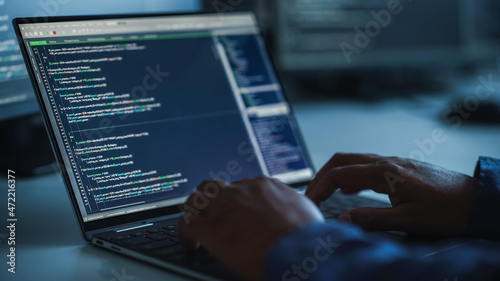 Close-up Focus on Person's Hands Typing on the Desktop Computer Keyboard. Screens Show Coding Language User Interface. Software Engineer Create Innovative e-Commerce App. Program Development