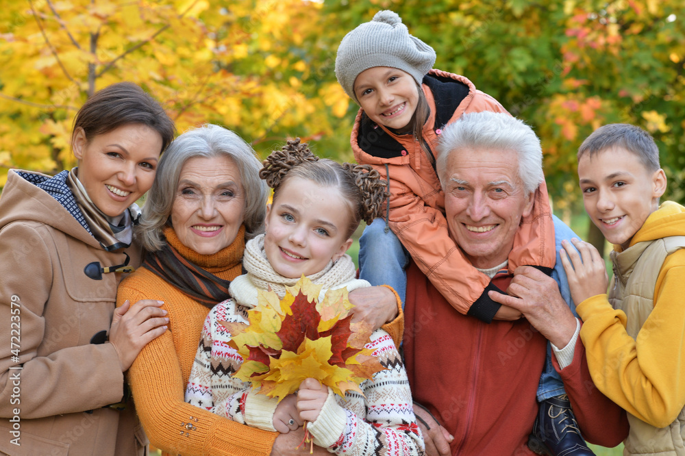 Fototapeta premium Portrait of happy family resting in park