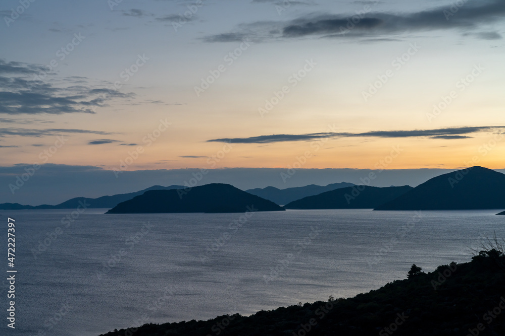 sunset on the Adriatic Highway in Croatia with a view of the coast and silhouettes of islands in the distance