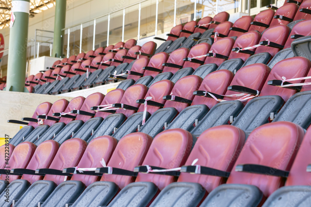Fototapeta premium Empty stadium seats, because of covid pandemic lockdown.