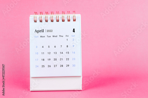 April 2022 desk calendar on pink