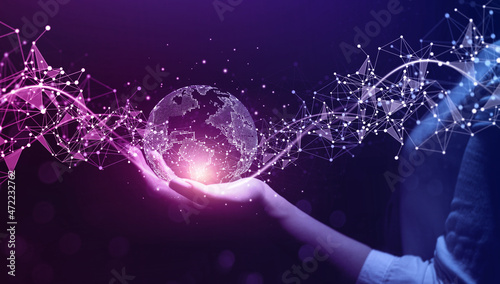 Metaverse Technology.Next generation technology.Global networking connection,science, innovation and communication technology.Hand holding earth globe with data exchanges on connection technology. photo