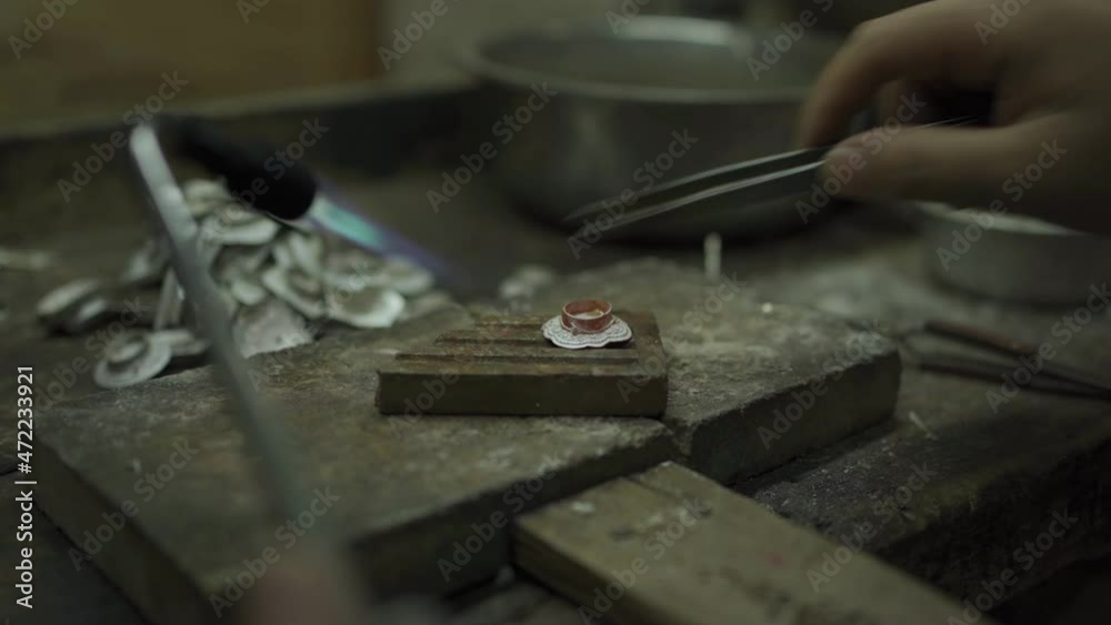 Jeweler at work in jewelry. Desktop for craft jewelry making with professional tools. Close up view of tools. Thailand. Jeweler at work in jewelry. Desktop for craft jewelry making with professional tools. Close up view of tools. Thailand.