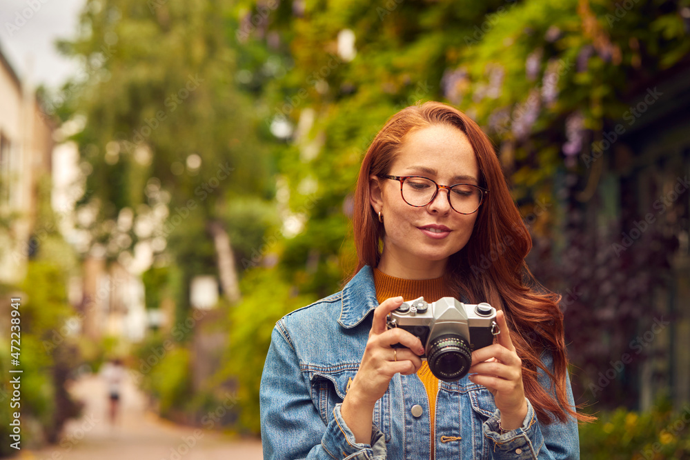 Young Woman In City Taking Photo On Digital Camera To Post To Social Media Young Woman In City Taking Photo On Digital Camera To Post To Social Media