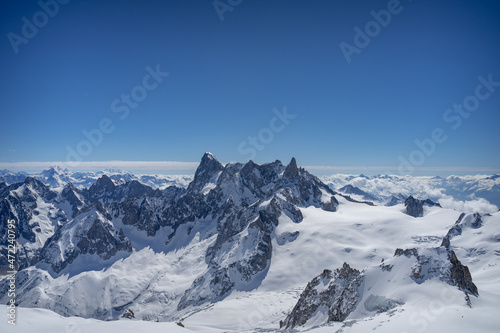 A view of the French Alps, Swiss Alps, and Italian Alps on a sunny summer day from the Aiguille du Midi near Mont Blanc in Chamonix, France © Sitting Bear Media