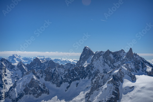 A view of the French Alps, Swiss Alps, and Italian Alps on a sunny summer day from the Aiguille du Midi near Mont Blanc in Chamonix, France