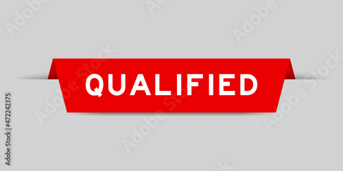 Red color inserted label with word qualified on gray background