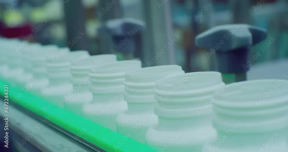 modern production. open empty plastic vials move along a conveyor.technological process close-up.