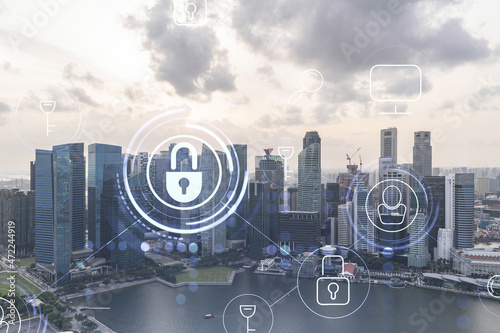 Hologram of padlock on sunset panoramic cityscape of Singapore, Asia. The concept of cyber security intelligence. Multi exposure.