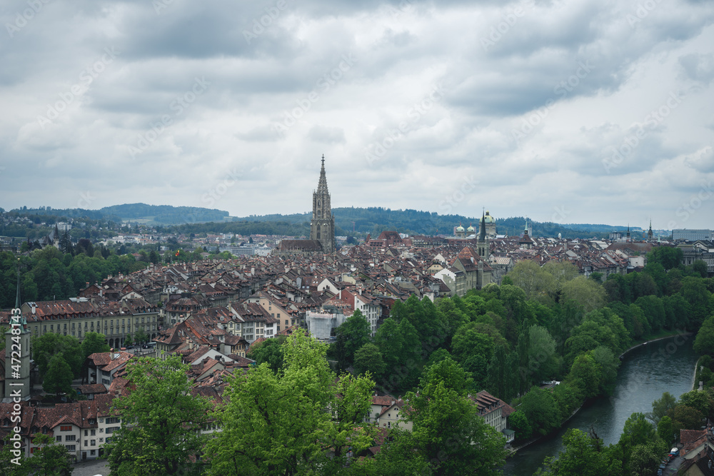 A view of Bern, Switzerland from the hill of Rosengarten (Rose Garden), with the red roofs of the city below - Aargauerstalden Viewpoint